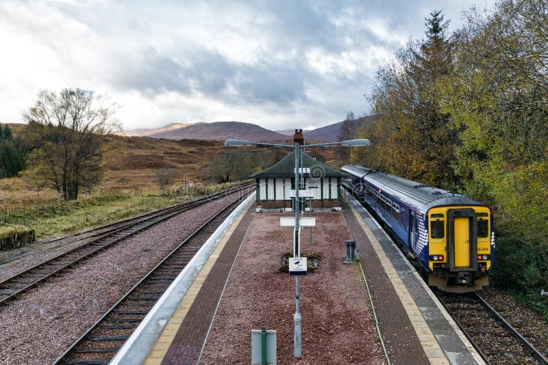 Rannoch, Scotland- Nov 4, 2019: A diesel train coming into platfrom 1 at the remote trainstation at Ronnoch. Rannoch, Scotland- Nov 4, 2019: A diesel train coming into platfrom 1 at the remote trainstation at Ronnoch