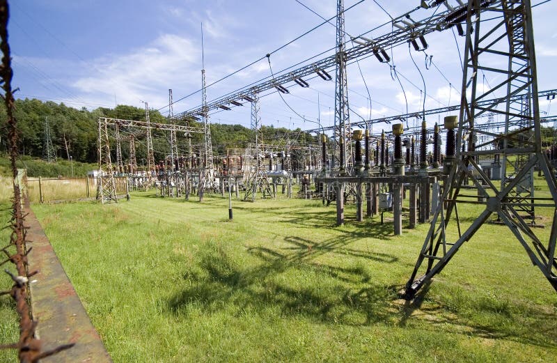 A power station, pylons, wires. A power station, pylons, wires.