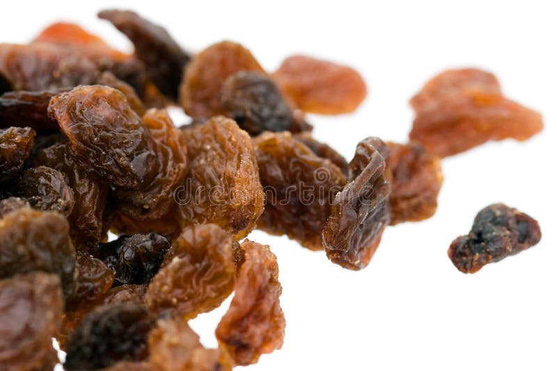 Raisins on white background - close up shot. Raisins on white background - close up shot