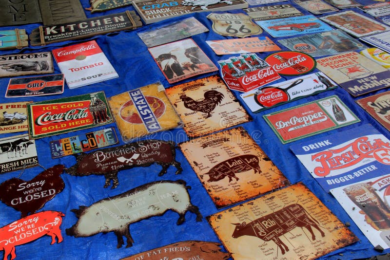 Groups of metal signs grouped together for sale, Elephant`s Trunk Flea Market, New Milford, CT, 2017. Groups of metal signs grouped together for sale, Elephant`s Trunk Flea Market, New Milford, CT, 2017.