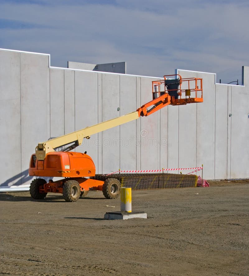 Elevated cherry picker on construction site. Elevated cherry picker on construction site