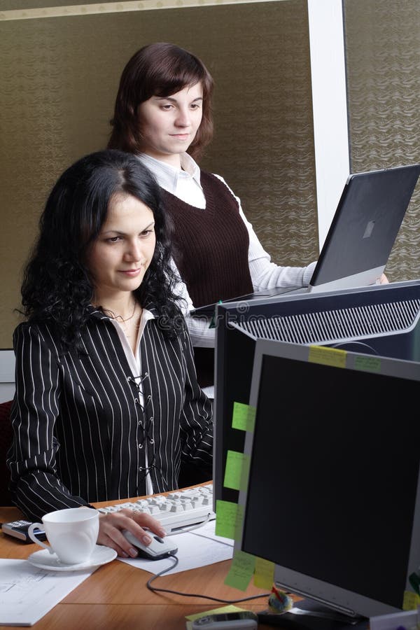 Group of 2 business people working together in the office. Group of 2 business people working together in the office.