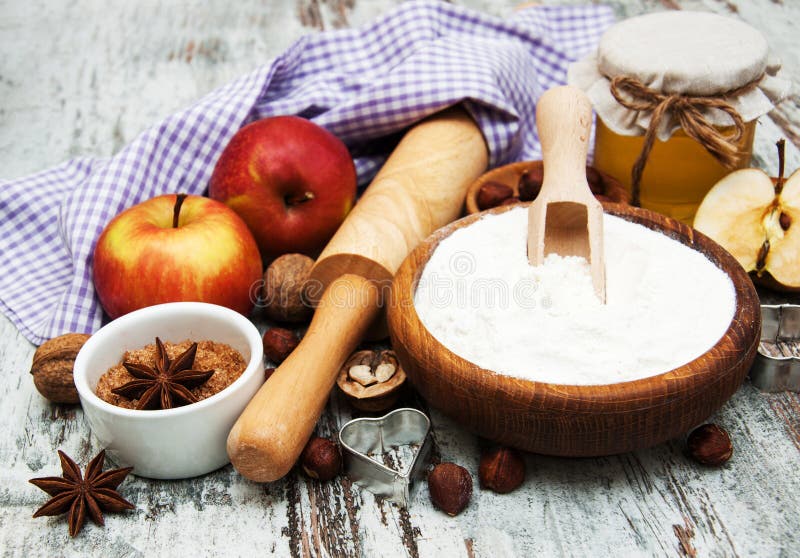 Ingredients for apple pie - red apple, butter, flour, brown sugar, nuts and spices. Ingredients for apple pie - red apple, butter, flour, brown sugar, nuts and spices