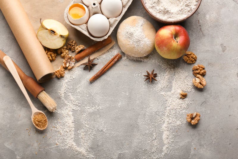 Ingredients for preparing bakery on grey background. Ingredients for preparing bakery on grey background