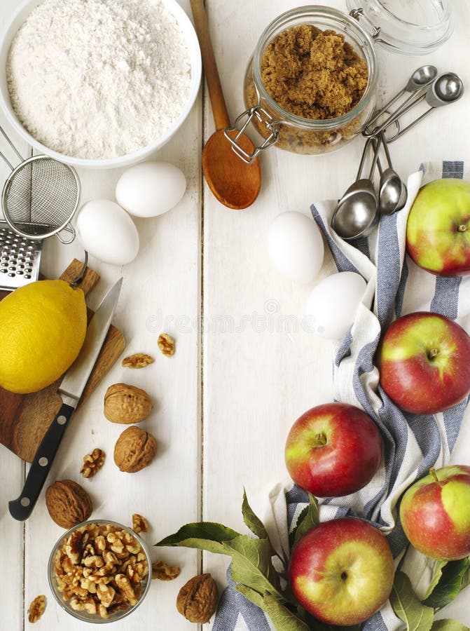 Ingredients for baking apple and nuts pie on wooden table, top view, copy space. Ingredients for baking apple and nuts pie on wooden table, top view, copy space