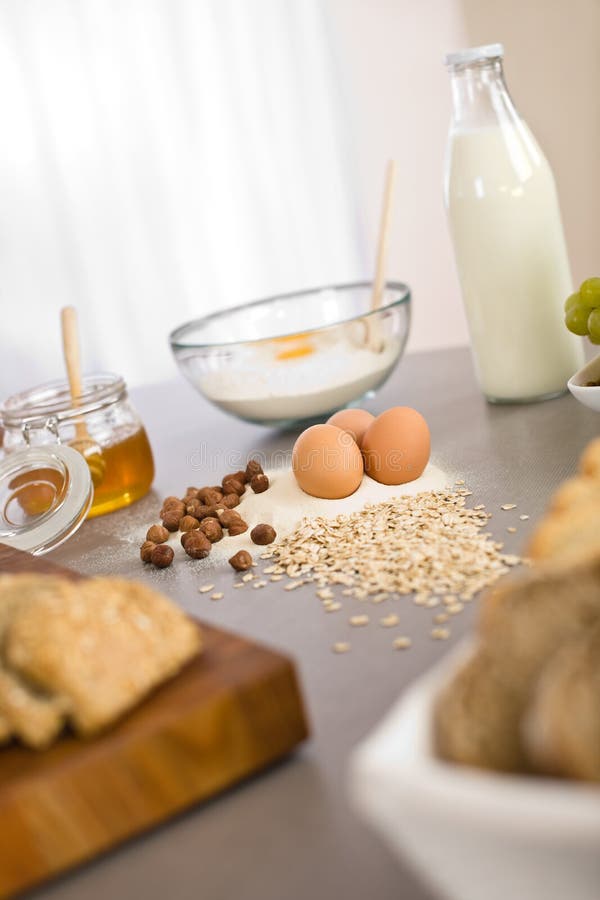 Baking dough ingredients, honey, eggs, flour in kitchen. Baking dough ingredients, honey, eggs, flour in kitchen