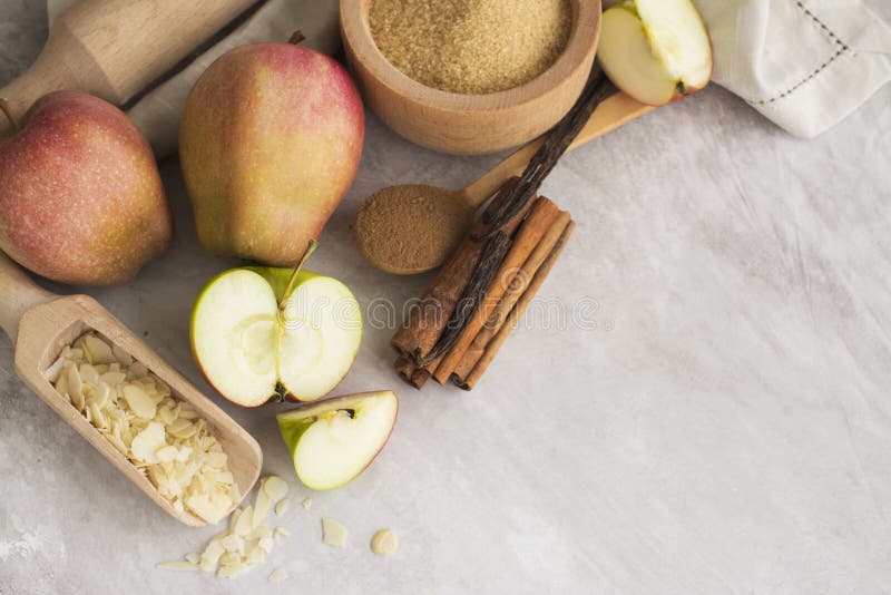 Apple pie or muffins ingredients over stone table. Cooking or baking concept. Space for text. Selective focus. Apple pie or muffins ingredients over stone table. Cooking or baking concept. Space for text. Selective focus