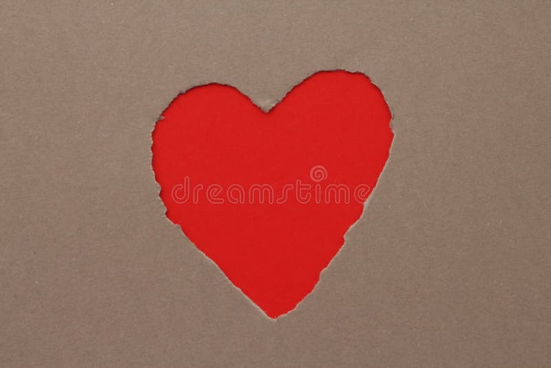 Torn red heart in paper with copy space. Torn red heart in paper with copy space