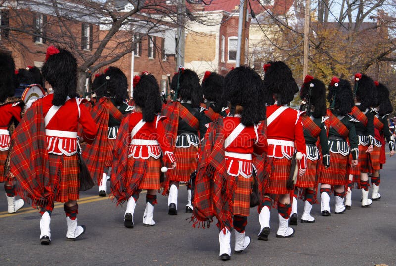 Pipe and drum band performing during the 37th annual Scottish Christmas Walk parade in City of Alexandria Old Town Washington DC area. Pipe and drum band performing during the 37th annual Scottish Christmas Walk parade in City of Alexandria Old Town Washington DC area