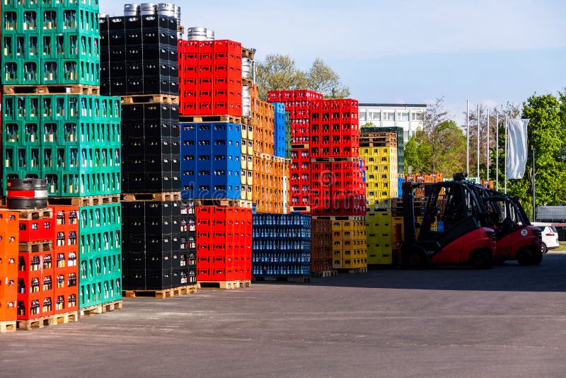 Several stacks of colorful beverage bottle crates outdoors. Several stacks of colorful beverage bottle crates outdoors