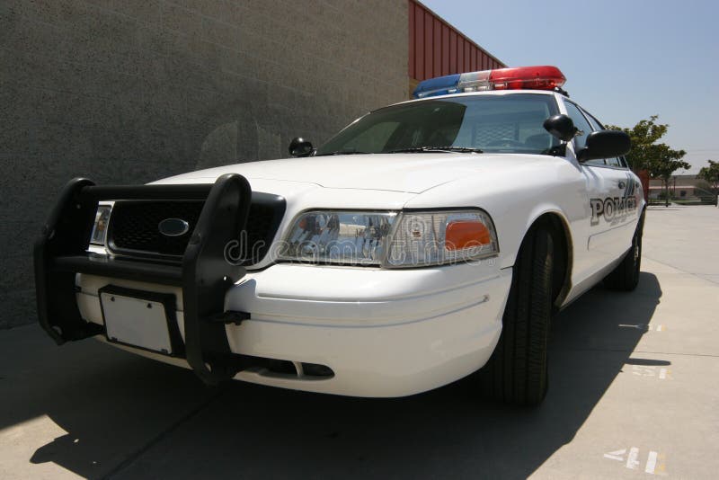 Front of modern police car guarding campus. Front of modern police car guarding campus