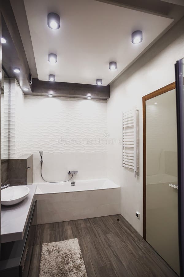 Modern bathroom in white and gray tones with mosaic on wide angle view. Real estate concept. Modern bathroom in white and gray tones with mosaic on wide angle view. Real estate concept