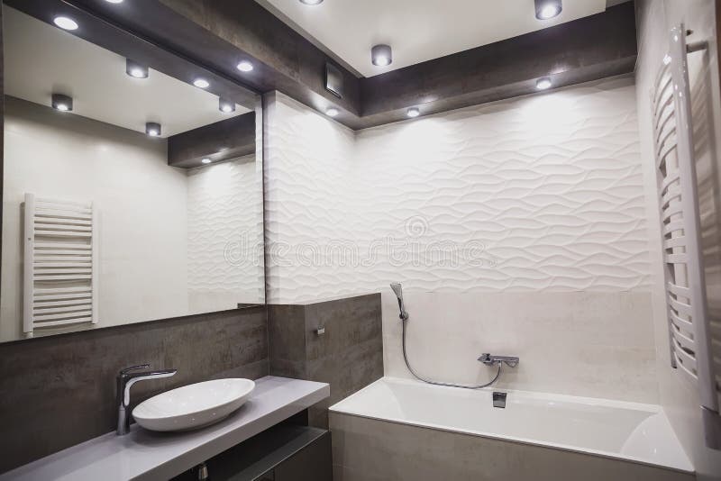 Modern bathroom in white and gray tones with mosaic on wide angle view. Real estate concept. Modern bathroom in white and gray tones with mosaic on wide angle view. Real estate concept