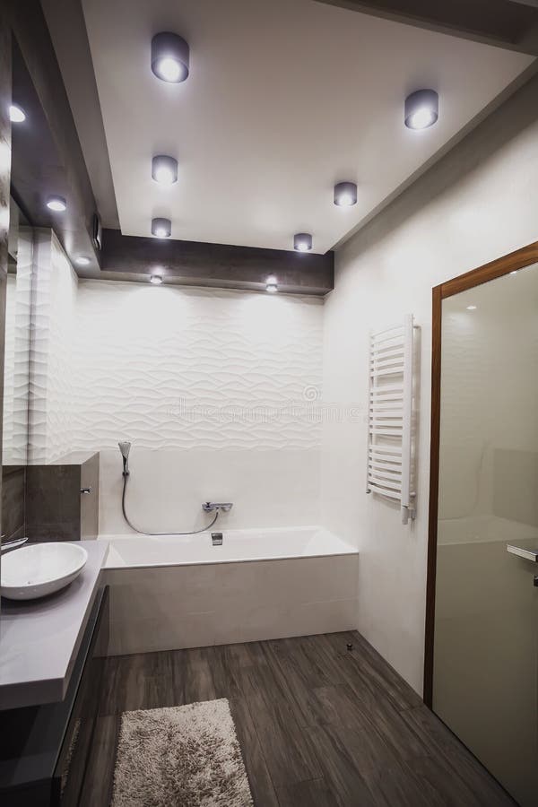 Modern bathroom in white and gray tones with mosaic on wide angle view. Real estate concept. Modern bathroom in white and gray tones with mosaic on wide angle view. Real estate concept