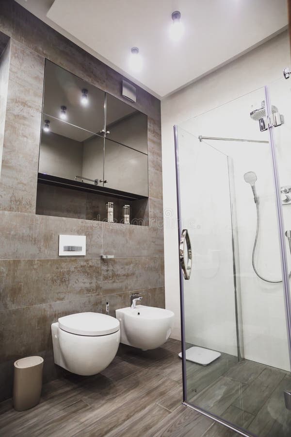 Modern bathroom in white and gray tones with mosaic on wide angle view. Real estate concept. Modern bathroom in white and gray tones with mosaic on wide angle view. Real estate concept.