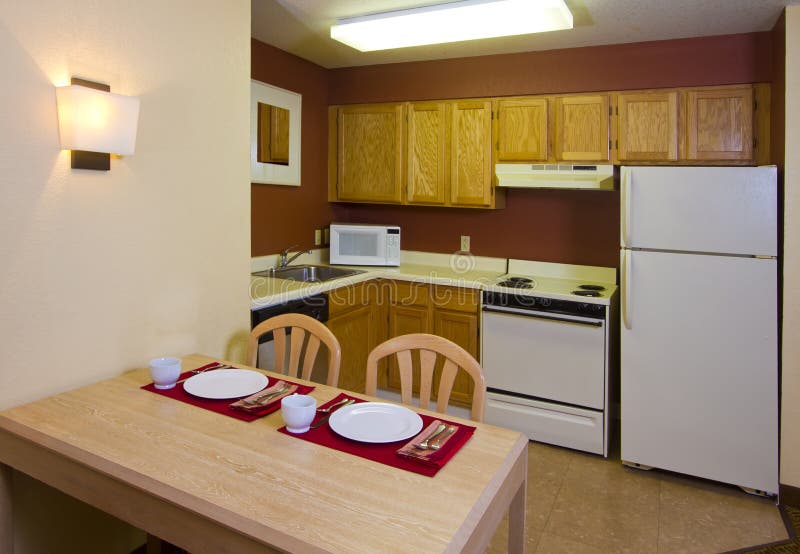 Modern kitchen, table, and appliances in resort hotel. Modern kitchen, table, and appliances in resort hotel