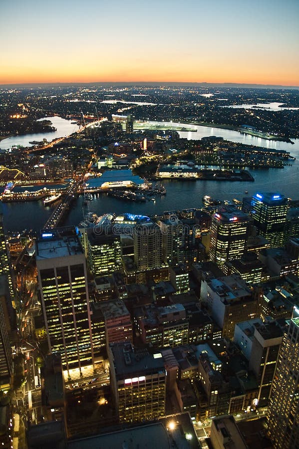 Aerial view of night Sydney cityscape. Darling Harbour and Anzac bridge visible. vertical photo. Aerial view of night Sydney cityscape. Darling Harbour and Anzac bridge visible. vertical photo.