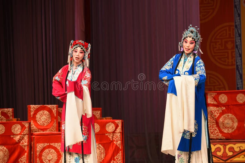 This opera tells a patriotic story how does an old woman of a hundred years old go out for a battle with the twelve women generals of Yang family herself. During the period of Renzong in Song Dynasty, the king of Western Xia invaded its border region, the Song Dynasty’s supreme commander Yang Zongbao fought against the enemies bravely with his army, but unfortunately, he died in the battle by an arrow shot from hiding. Meanwhile, She Taijun of one hundred years old in Yang family was giving a banquet to celebrate her grandson Zongbao’s fiftieth birthday. Everyone in the family was grieved deeply when the tragic news came. When She Taijun heard that the royal court was going to cede territories for peace, she suppressed her grief, refuted the fallacy sternly, and decided to go for the battle herself with the women generals of the Yang family. The great-grandson Yang Wenguang wanted to go with them, his grandmother Princess Chai didn’t let him go in consideration of perpetuating the Yang line. She Taijun told him that he could challenge martial art skills with his mother Mu Guiying to prove whether he can go or not. With his mother’s pretending to fail by his spear skill and the help of Du Jine, the wife of Yang Yansi, Yang Wenguang got his wish. After being defeated utterly, the king of Western Xia intended to capture Yang The Beijing Opera Women Generals of Yang Family was performed in Jiangxi Art Center by The Beijing Opera Troupe of Fujian Province. This opera tells a patriotic story how does an old woman of a hundred years old go out for a battle with the twelve women generals of Yang family herself. During the period of Renzong in Song Dynasty, the king of Western Xia invaded its border region, the Song Dynasty’s supreme commander Yang Zongbao fought against the enemies bravely with his army, but unfortunately, he died in the battle by an arrow shot from hiding. Meanwhile, She Taijun of one hundred years old in Yang family was giving a banquet to celebrate her grandson Zongbao’s fiftieth birthday. Everyone in the family was grieved deeply when the tragic news came. When She Taijun heard that the royal court was going to cede territories for peace, she suppressed her grief, refuted the fallacy sternly, and decided to go for the battle herself with the women generals of the Yang family. The great-grandson Yang Wenguang wanted to go with them, his grandmother Princess Chai didn’t let him go in consideration of perpetuating the Yang line. She Taijun told him that he could challenge martial art skills with his mother Mu Guiying to prove whether he can go or not. With his mother’s pretending to fail by his spear skill and the help of Du Jine, the wife of Yang Yansi, Yang Wenguang got his wish. After being defeated utterly, the king of Western Xia intended to capture Yang The Beijing Opera Women Generals of Yang Family was performed in Jiangxi Art Center by The Beijing Opera Troupe of Fujian Province.