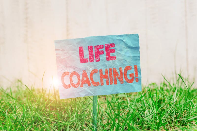 Text sign showing Life Coaching. Business photo showcasing demonstrating employed to help showing attain their goals in career Plain empty paper attached to a stick and placed in the green grassy land. Text sign showing Life Coaching. Business photo showcasing demonstrating employed to help showing attain their goals in career Plain empty paper attached to a stick and placed in the green grassy land