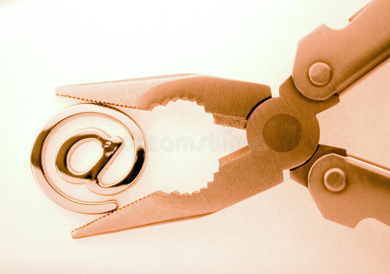 E-mail metallic symbol and pliers. E-mail metallic symbol and pliers