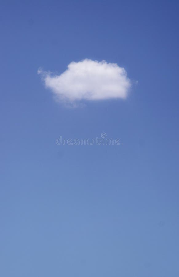 One single little cloud on a clear blue sky. One single little cloud on a clear blue sky