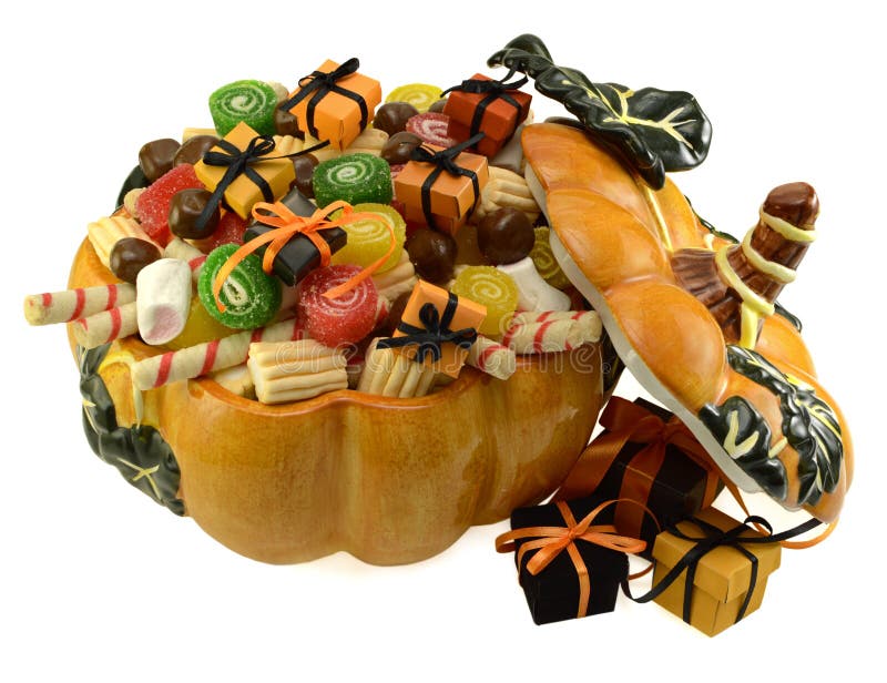 Pumpkin dish full of sweets and gifts isolated. Pumpkin dish full of sweets and gifts isolated