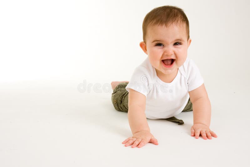 Baby Crawling with a big smile on her face. Baby Crawling with a big smile on her face