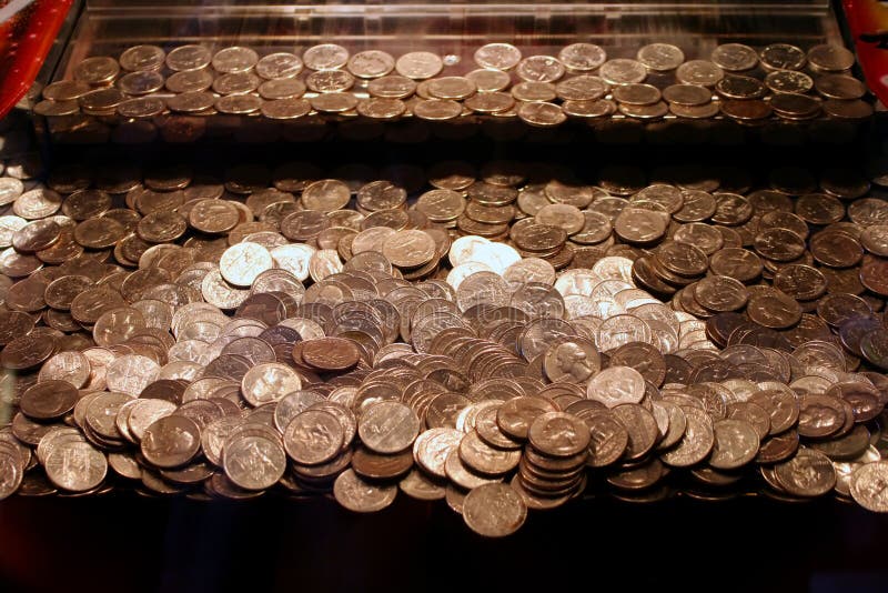 Arcade game with piles of quarters. Arcade game with piles of quarters.