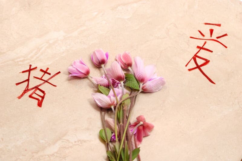 Flowers and chinese symbols in a stone background. Flowers and chinese symbols in a stone background