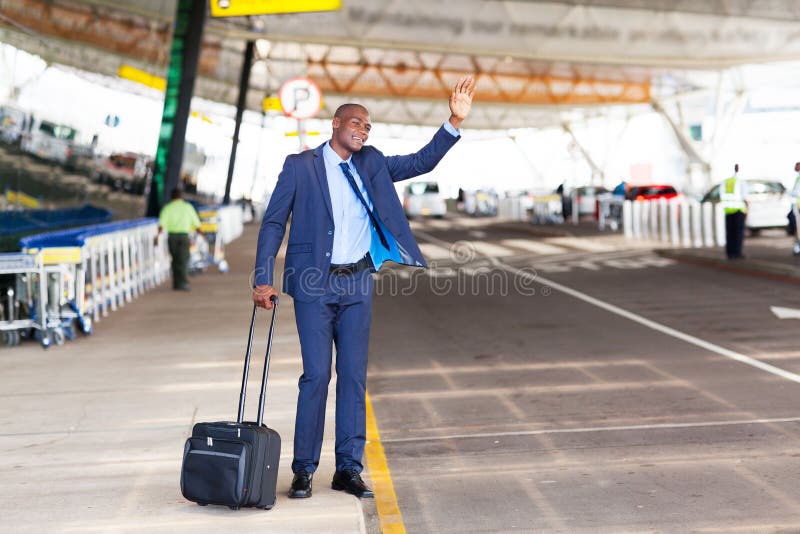 African american businessman calling taxi in airport. African american businessman calling taxi in airport