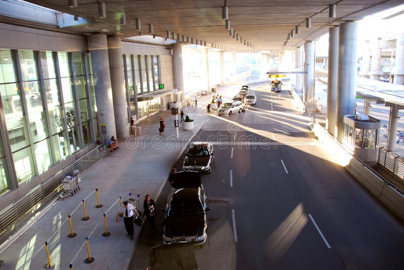 Travelers getting taxis at airport. Travelers getting taxis at airport