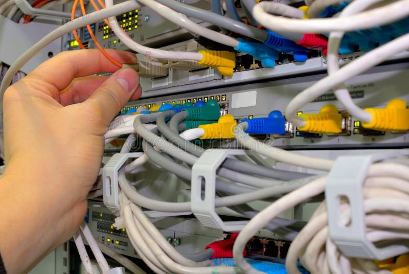 Engineer, technician checks fibre network connections. Engineer, technician checks fibre network connections