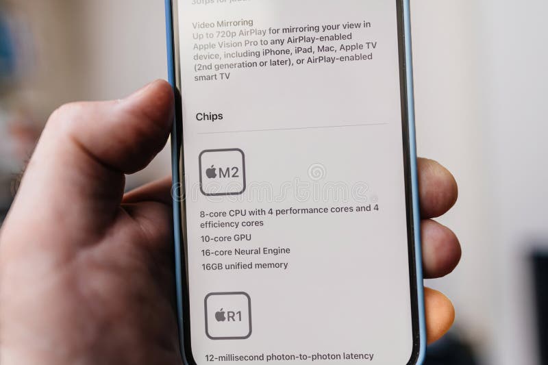 California, USA - Jan 21, 2024: A close-up macro shot of the iPhone 15 Pro highlights the technology in the Apple Vision Pro mixed reality headset by Apple Inc. It features the M2 and R1 CPU GPU, multiple cores, and 16GB unified memory, ensuring a remarkable 12-millisecond photon-to-photon latency. California, USA - Jan 21, 2024: A close-up macro shot of the iPhone 15 Pro highlights the technology in the Apple Vision Pro mixed reality headset by Apple Inc. It features the M2 and R1 CPU GPU, multiple cores, and 16GB unified memory, ensuring a remarkable 12-millisecond photon-to-photon latency
