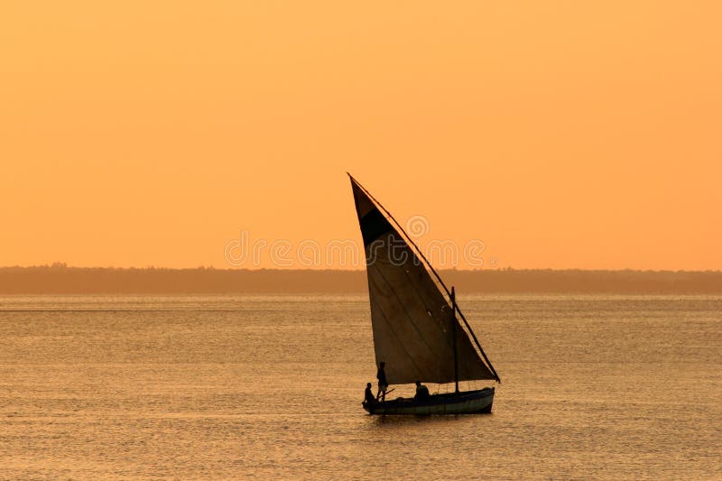 Traditional sail boat (dhow) at sunset, Vilanculos, Mozambique, southern Africa. Traditional sail boat (dhow) at sunset, Vilanculos, Mozambique, southern Africa