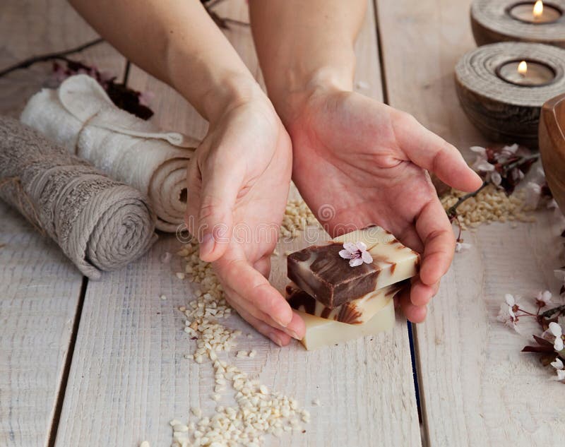 Spa and wellness manicure setting with natural soap, candles and towel. Beige dayspa nature set. Spa and wellness manicure setting with natural soap, candles and towel. Beige dayspa nature set