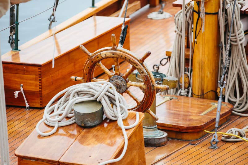 Steering wheel of a wooden vessel on deck. Steering wheel of a wooden vessel on deck