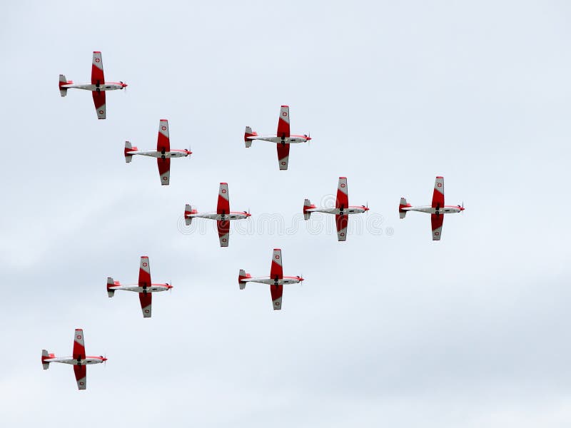 EMMEN - JULY 24: Group of historic Piaggio P 149D showcasing excellence in Formation flying at the Airshow 100 years Swiss aviation July 24, 2010 in Emmen, Switzerland. EMMEN - JULY 24: Group of historic Piaggio P 149D showcasing excellence in Formation flying at the Airshow 100 years Swiss aviation July 24, 2010 in Emmen, Switzerland.