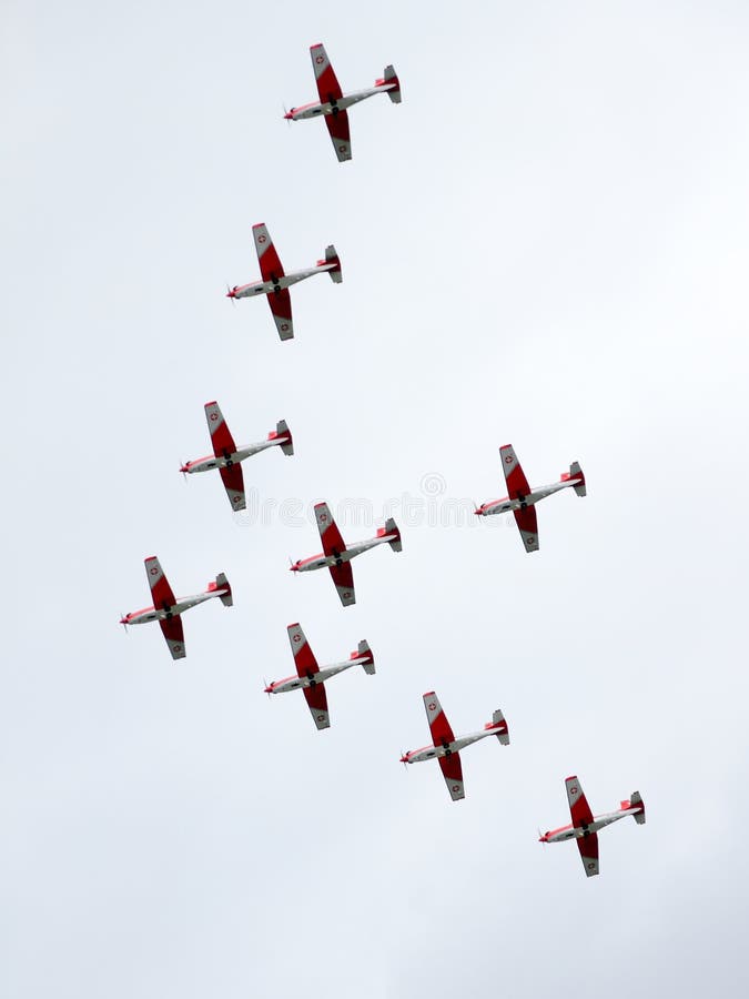 EMMEN - JULY 24: Group of historic Piaggio P 149D showcasing excellence in Formation flying at the Airshow 100 years Swiss aviation July 24, 2010 in Emmen, Switzerland. EMMEN - JULY 24: Group of historic Piaggio P 149D showcasing excellence in Formation flying at the Airshow 100 years Swiss aviation July 24, 2010 in Emmen, Switzerland.