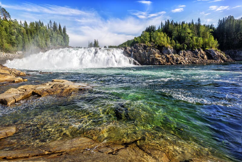 Laksforsen is a waterfall of 17 meters. The river is called Vefsna and the average amount of water going through the waterfall is 700 m3/sec. Norway. Laksforsen is a waterfall of 17 meters. The river is called Vefsna and the average amount of water going through the waterfall is 700 m3/sec. Norway.