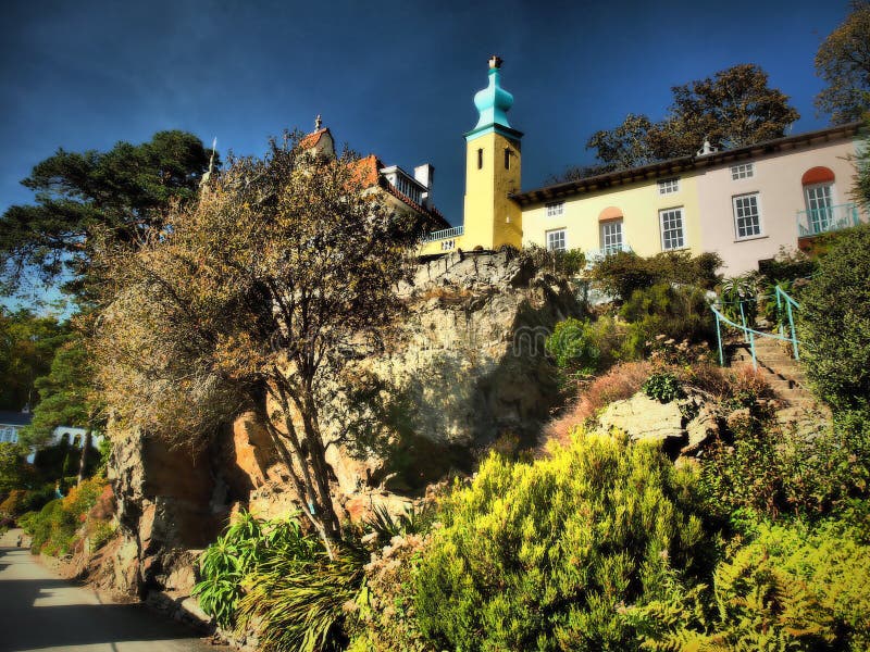 Portmeirion is a tourist village in Gwynedd, North Wales. It was designed and built by Sir Clough Williams-Ellis between 1925 and 1975 in the style of an Italian village, and is now owned by a charitable trust.
The village is located in the community of Penrhyndeudraeth, on the estuary of the River Dwyryd, 2 miles south east of Porthmadog, and 1 mile from Minffordd railway station.Portmeirion has served as the location for numerous films and television shows, and was `The Village` in the 1960s television show The Prisoner. Portmeirion is a tourist village in Gwynedd, North Wales. It was designed and built by Sir Clough Williams-Ellis between 1925 and 1975 in the style of an Italian village, and is now owned by a charitable trust.
The village is located in the community of Penrhyndeudraeth, on the estuary of the River Dwyryd, 2 miles south east of Porthmadog, and 1 mile from Minffordd railway station.Portmeirion has served as the location for numerous films and television shows, and was `The Village` in the 1960s television show The Prisoner.