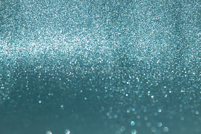 Το Sparkly ακτινοβολεί, μπλε επίδραση υποβάθρου bokeh στοκ φωτογραφία