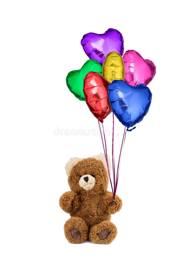 Το Teddy αντέχει τα ζωηρόχρωμα διαμορφωμένα καρδιά μπαλόνια στοκ εικόνα