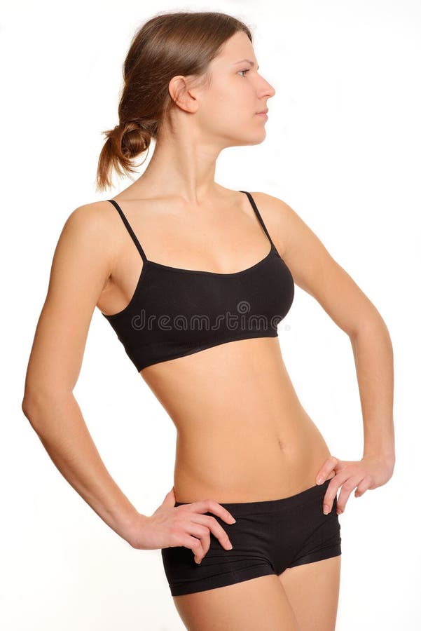 Το νέο και λεπτό κορίτσι μαύρο sportswear στοκ φωτογραφία Το νέο και λεπτό κορίτσι μαύρο sportswear στοκ φωτογραφία