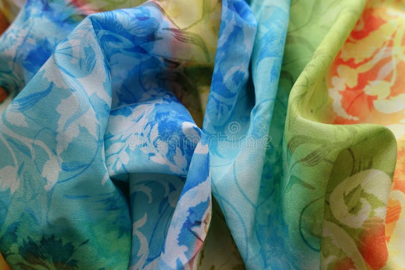 Rainbow colored bright folded viscose chiffon fabric. Rainbow colored bright folded viscose chiffon fabric