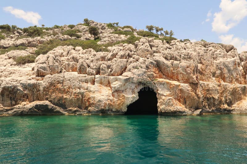 The fascinating Pirate Cave or Blue Cave on Asirli Island in the Gökkaya Bay close to Demre, Turkey 2022. The fascinating Pirate Cave or Blue Cave on Asirli Island in the Gökkaya Bay close to Demre, Turkey 2022