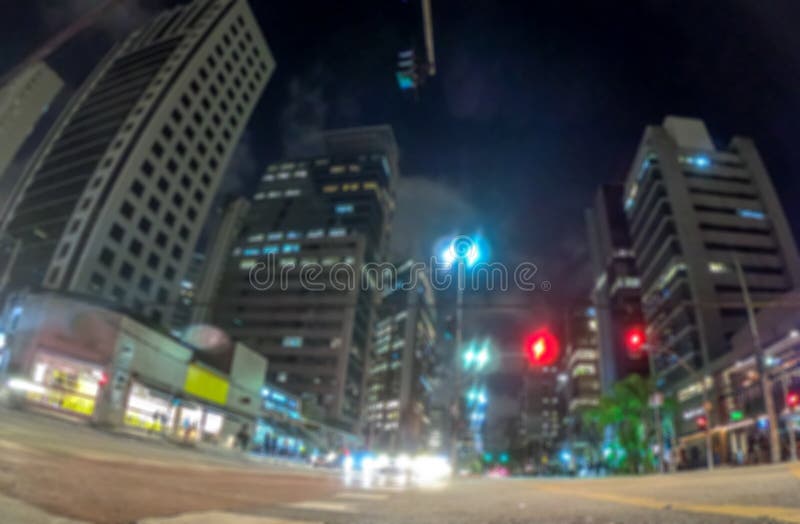 Το φως νύχτας bokeh στη μεγάλη πόλη, αφηρημένη θαμπάδα το υπόβαθρο στοκ εικόνα με δικαίωμα ελεύθερης χρήσης Το φως νύχτας bokeh στη μεγάλη πόλη, αφηρημένη θαμπάδα το υπόβαθρο στοκ εικόνα με δικαίωμα ελεύθερης χρήσης