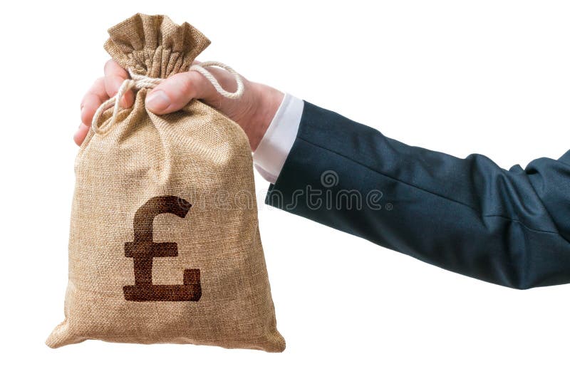 Hand of business man holds bag full of money with British pound sign. Isolated on white background. Hand of business man holds bag full of money with British pound sign. Isolated on white background.