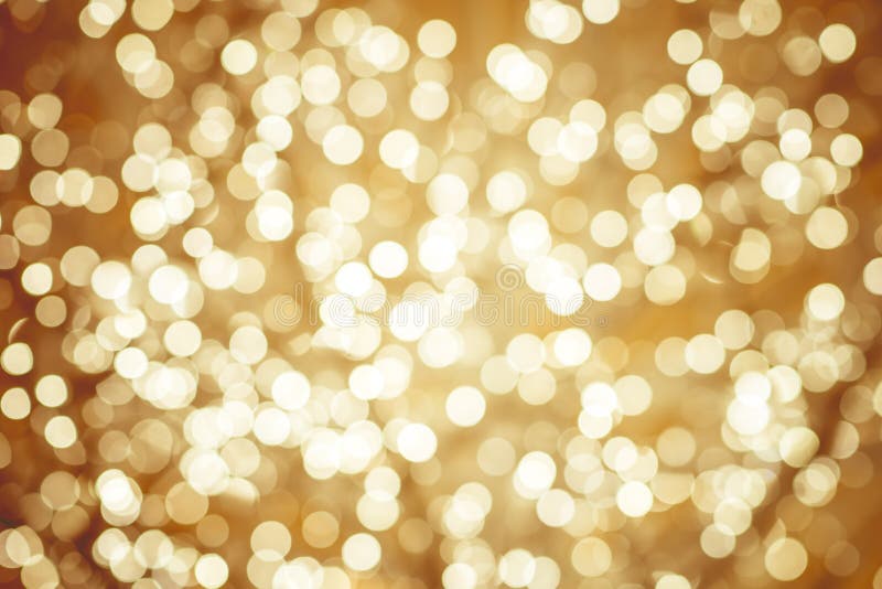 Το χρυσό υπόβαθρο με το φυσικό bokeh τα φω'τα σπινθηρίσματος στοκ φωτογραφίες με δικαίωμα ελεύθερης χρήσης