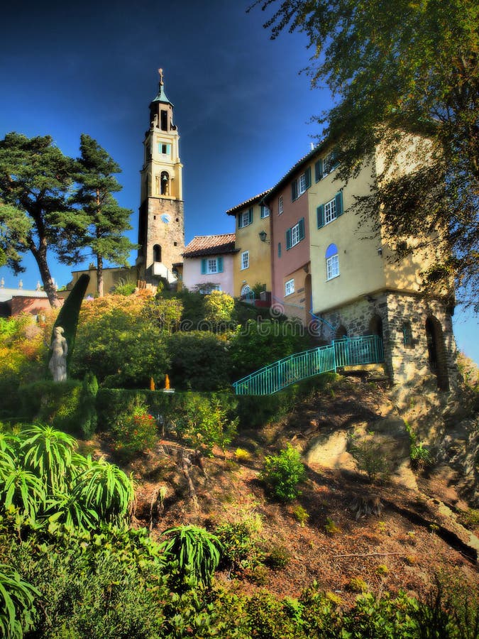 Portmeirion is a tourist village in Gwynedd, North Wales. It was designed and built by Sir Clough Williams-Ellis between 1925 and 1975 in the style of an Italian village, and is now owned by a charitable trust.
The village is located in the community of Penrhyndeudraeth, on the estuary of the River Dwyryd, 2 miles south east of Porthmadog, and 1 mile from Minffordd railway station.Portmeirion has served as the location for numerous films and television shows, and was `The Village` in the 1960s television show The Prisoner. Portmeirion is a tourist village in Gwynedd, North Wales. It was designed and built by Sir Clough Williams-Ellis between 1925 and 1975 in the style of an Italian village, and is now owned by a charitable trust.
The village is located in the community of Penrhyndeudraeth, on the estuary of the River Dwyryd, 2 miles south east of Porthmadog, and 1 mile from Minffordd railway station.Portmeirion has served as the location for numerous films and television shows, and was `The Village` in the 1960s television show The Prisoner.