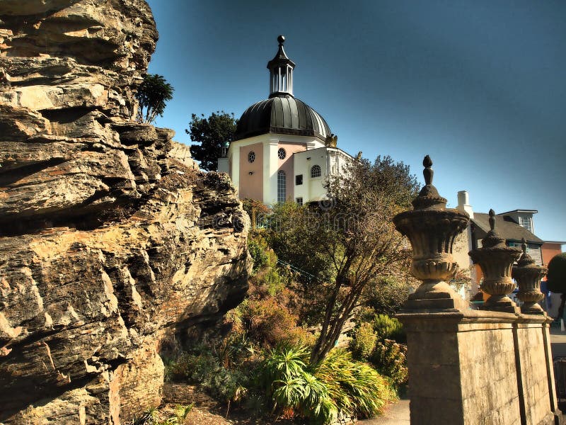 Portmeirion is a tourist village in Gwynedd, North Wales. It was designed and built by Sir Clough Williams-Ellis between 1925 and 1975 in the style of an Italian village, and is now owned by a charitable trust.
The village is located in the community of Penrhyndeudraeth, on the estuary of the River Dwyryd, 2 miles south east of Porthmadog, and 1 mile from Minffordd railway station.Portmeirion has served as the location for numerous films and television shows, and was `The Village` in the 1960s television show The Prisoner. Portmeirion is a tourist village in Gwynedd, North Wales. It was designed and built by Sir Clough Williams-Ellis between 1925 and 1975 in the style of an Italian village, and is now owned by a charitable trust.
The village is located in the community of Penrhyndeudraeth, on the estuary of the River Dwyryd, 2 miles south east of Porthmadog, and 1 mile from Minffordd railway station.Portmeirion has served as the location for numerous films and television shows, and was `The Village` in the 1960s television show The Prisoner.